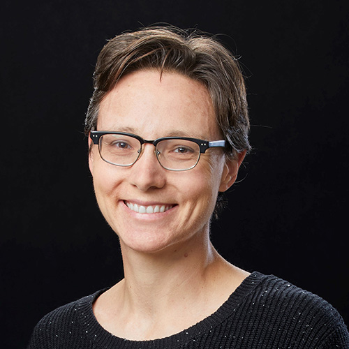 Headshot of Lawrence Livermore researcher Jamie Bramwell. She smiles and wears a black blouse. She stands in front of a black background.